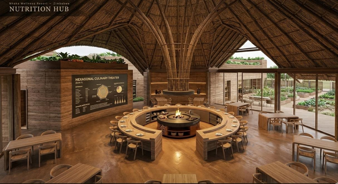 Zende nutrition hub — communal culinary theatre under a vaulted thatched roof, with garden views